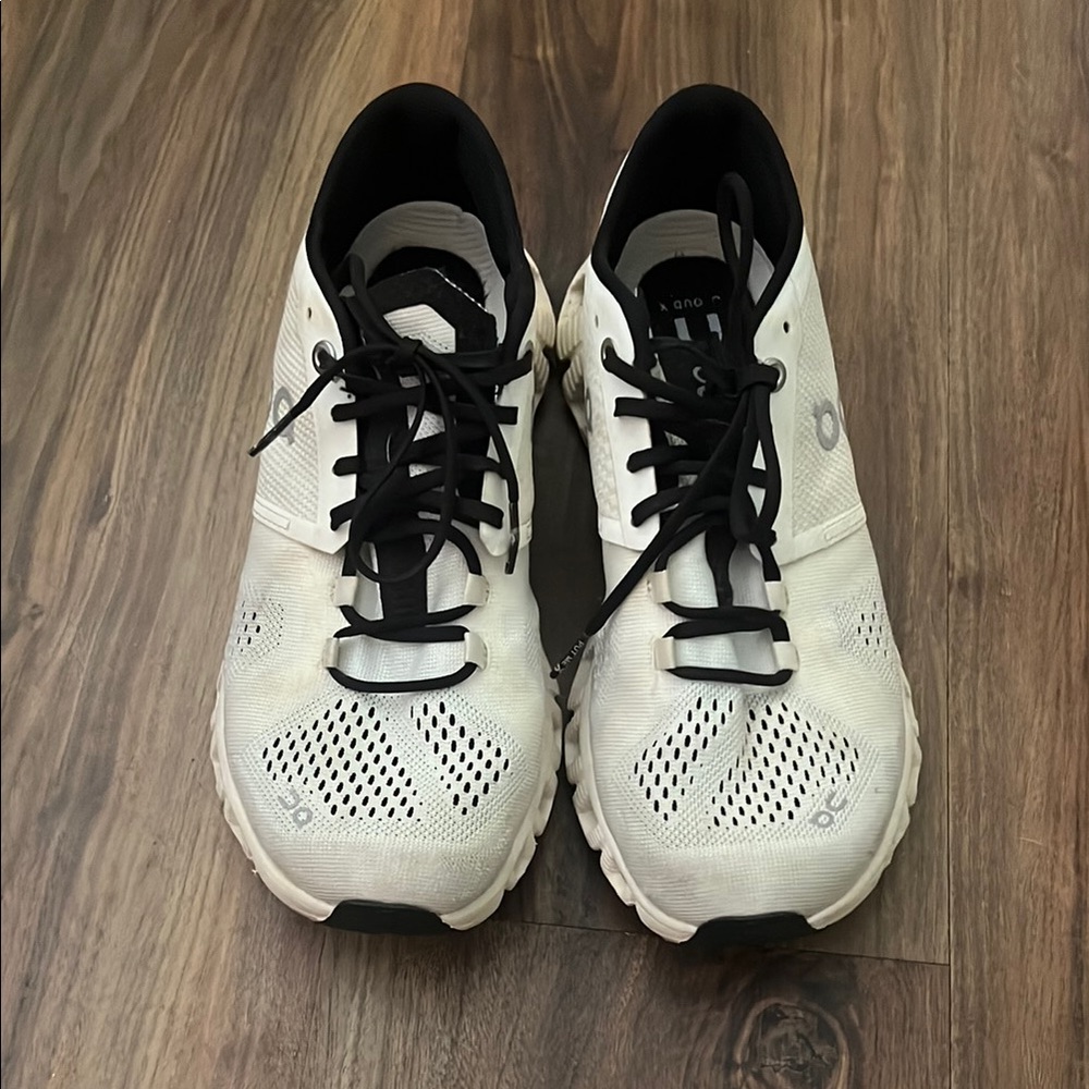 On Cloud White and Black Athletic Shoes